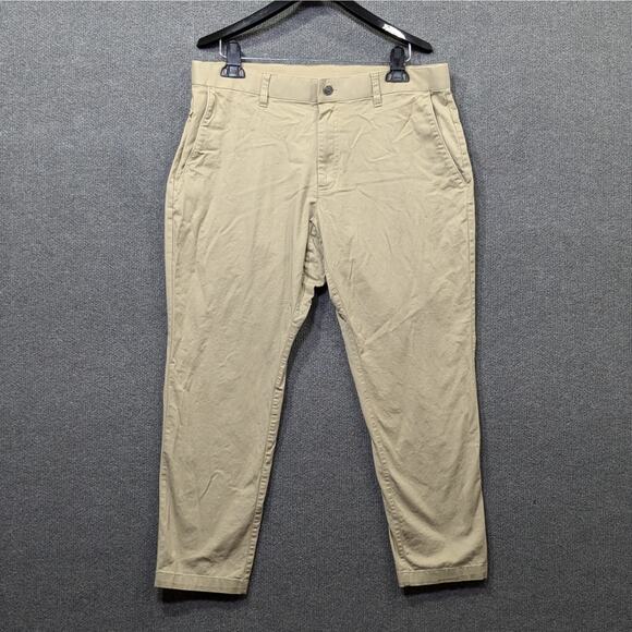 Fabletics The High Side Pants Mens 34x27 Chinos Khaki Stretch Tan Flat Front - Picture 1 of 11